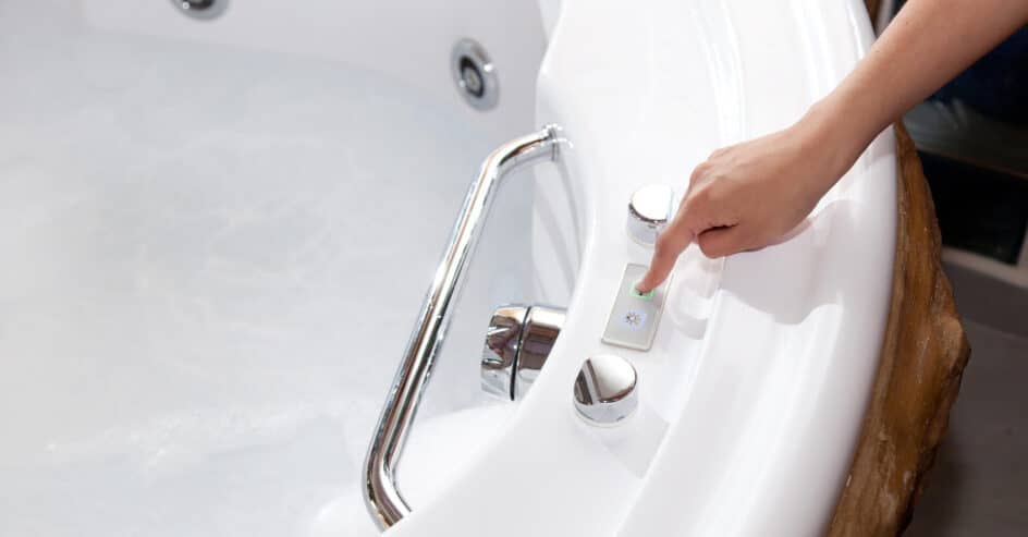 Woman setting up whirlpool tub