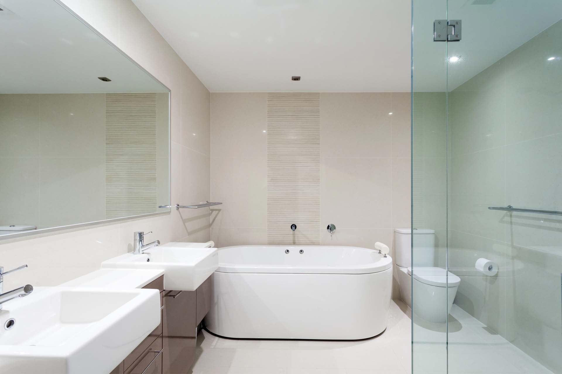 Bathtub and shower combination in a neutral bathroom