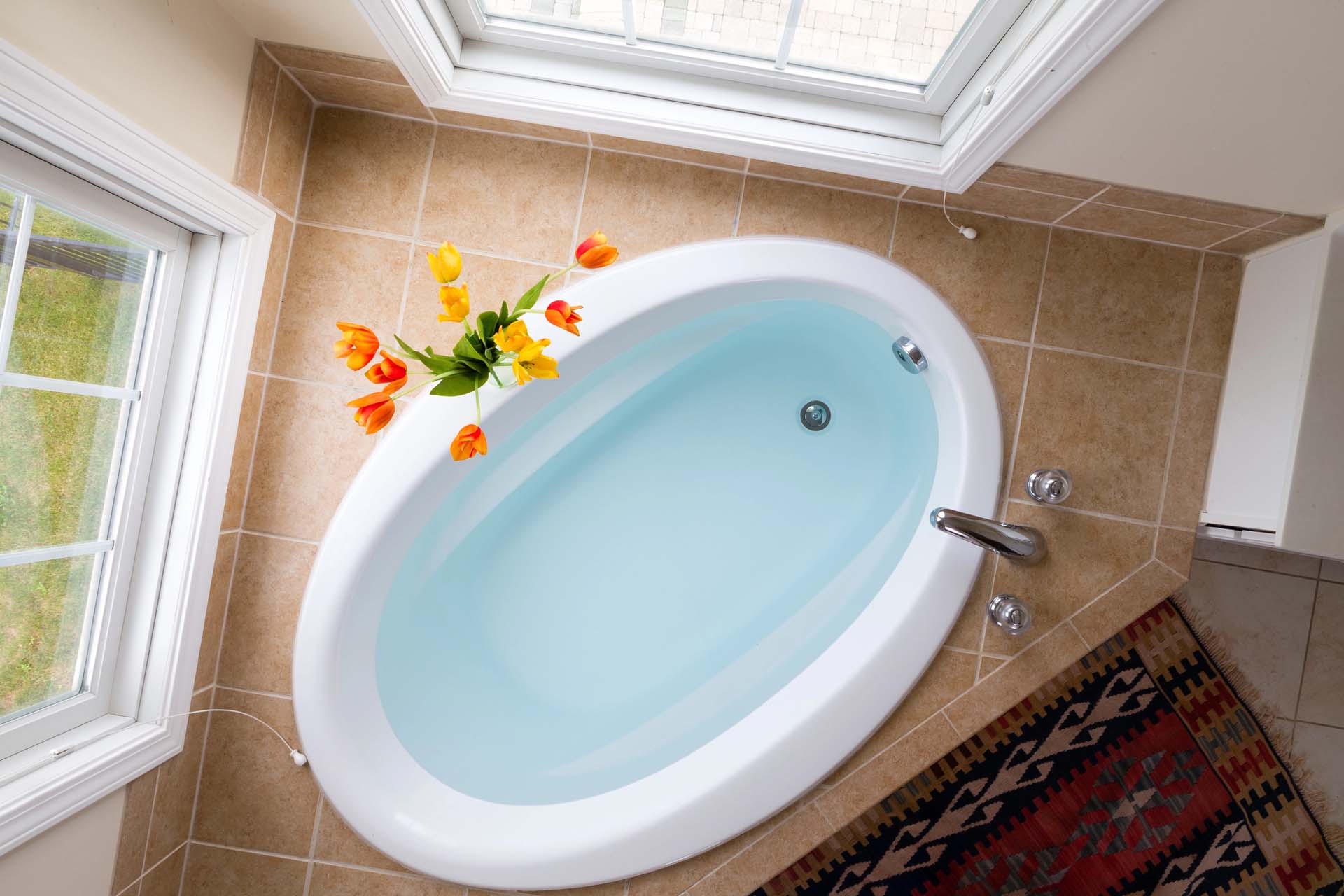 Whirlpool tub with massaging jets for a spa-style bathing experience