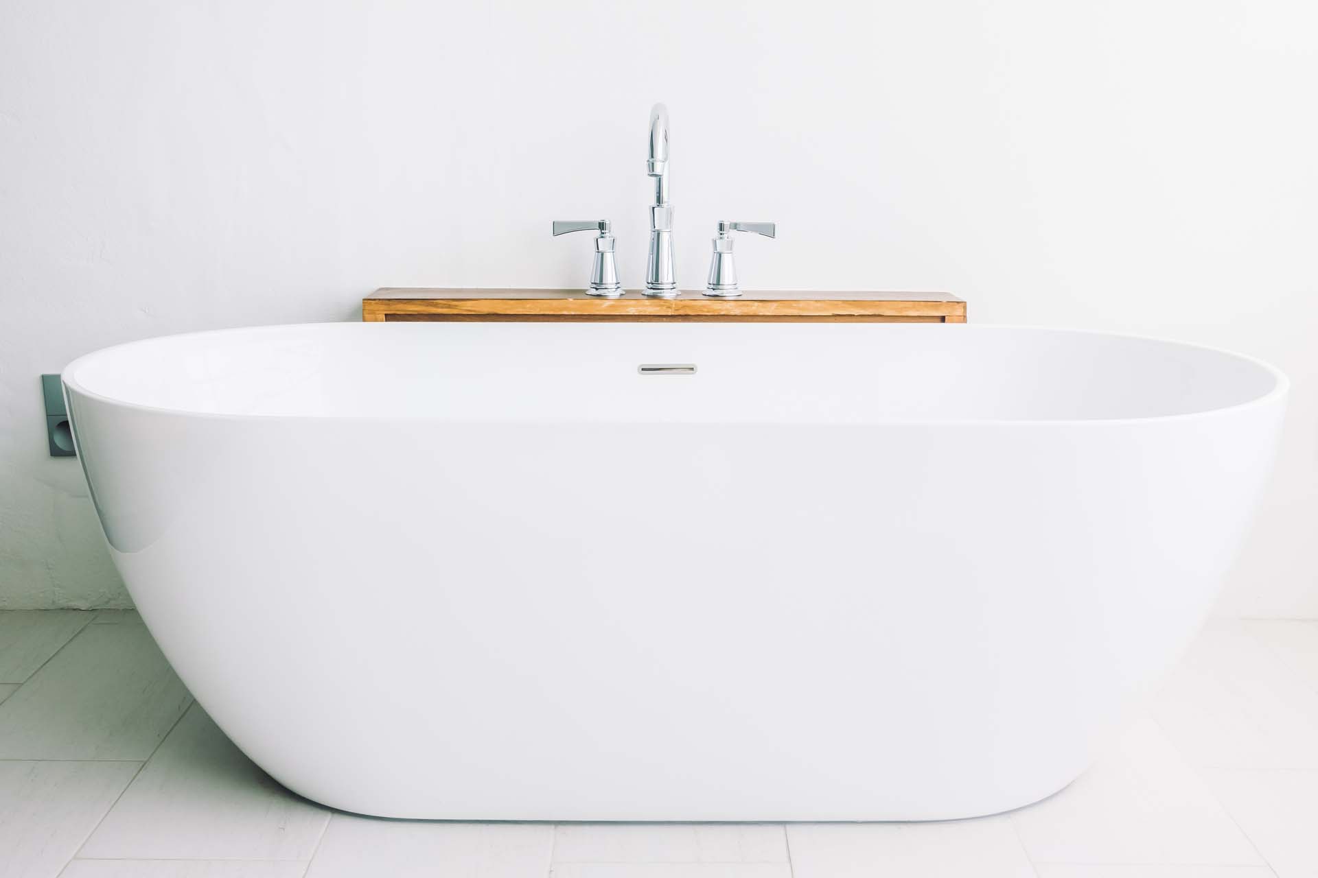 Deep soaking tub for still-water relaxation in a New Orleans bathroom